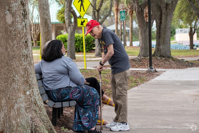 Groves locals stop for a chat at City Center.