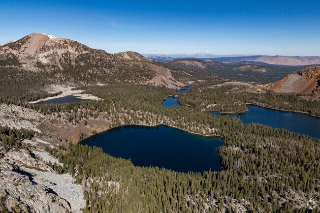 Mammoth Lakes hikers enjoy amazing views from Crystal Crag looking down over the Mammoth Lake Basin.