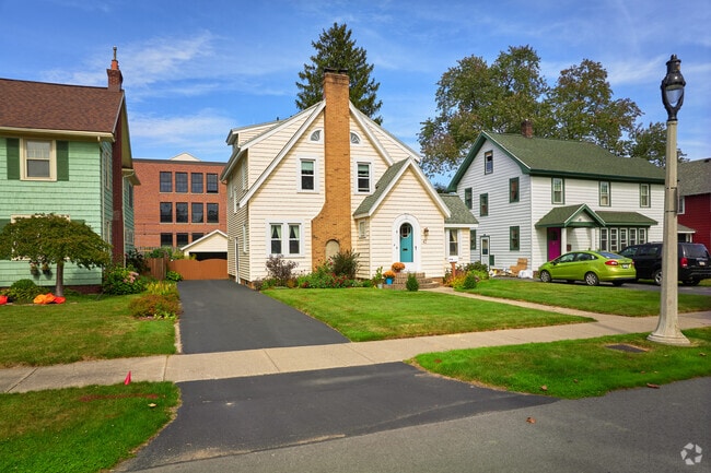 Homes in Irondequoit, NY are characterized by their charming, steeply pitched roofs.