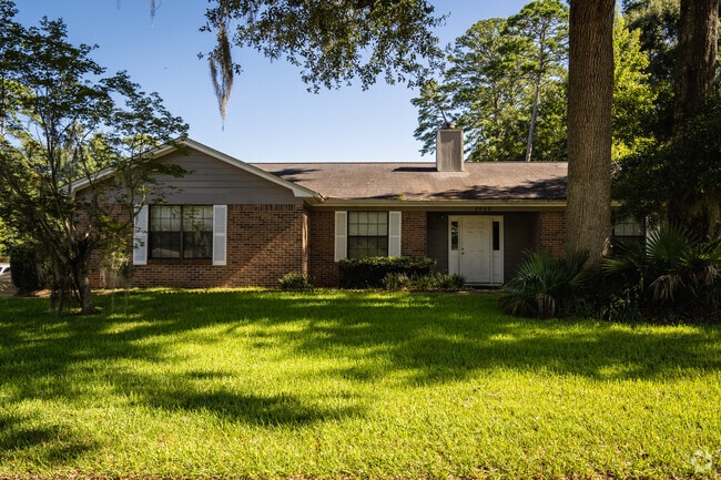 Brick ranch-style home is typical of midcentury architecture here.