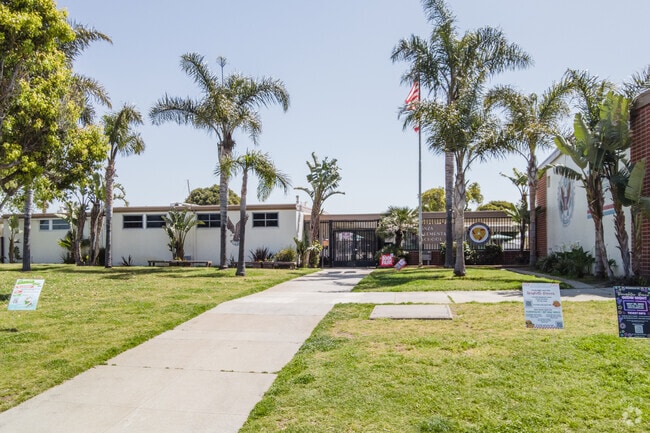 The well-landscaped entrance shaded by palm trees at Anza Elementary School in Southwood.