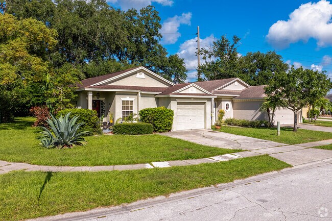 Mill Slough homes showcase well-manicured lawns with lush landscaping.