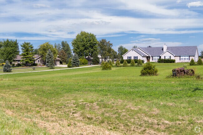 Many of Raymond’s homes feature long driveways and privacy landscaping.