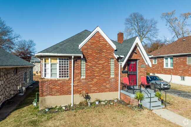 This cottage style home features unique windows in Velda Village Hills.