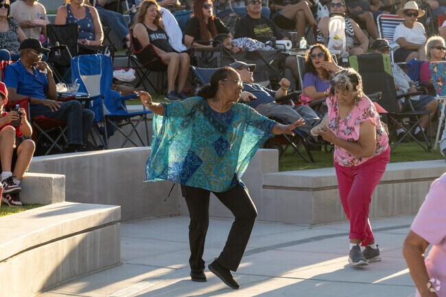 Some audience members will put on a show on the dance floor for MoVal Rocks at Moreno Valley Civic Center Amphitheater near Butterfield.