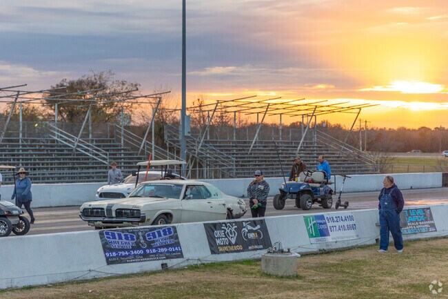 The sun sets on the drag strip at Tulsa Raceway Park.