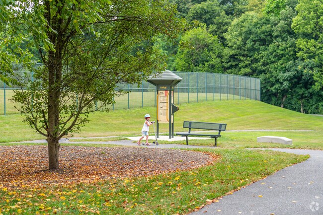 Kids ride scooters along paved paths at Gelder Park in Lower Swatara Township.