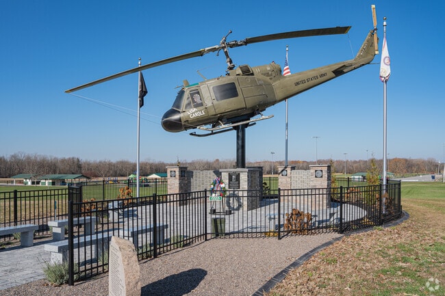 The veterans memorial at Hartland Town Park features a Vietnam War helicopter installation.