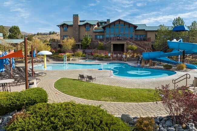 The Club at Somersett has an elaborate pool deck with water slide and hot tubs.