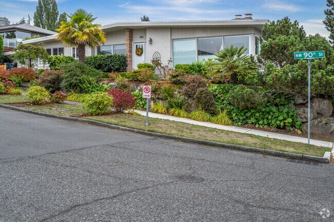 Midcentury homes in Olympic Manor feature oversize windows to let in the view.