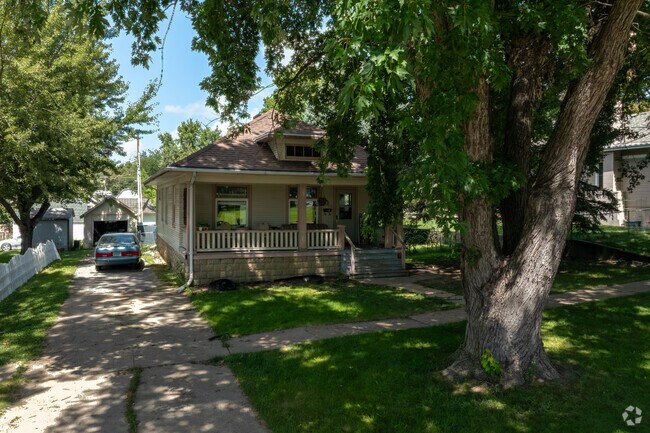 National-style homes sit on lots with mature trees and sidewalks in Wahoo.