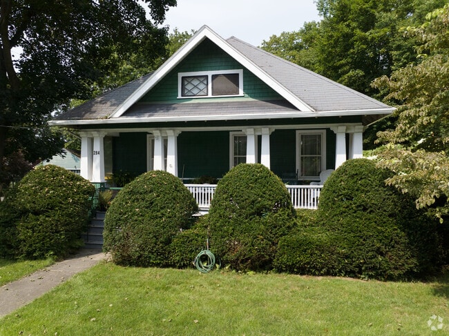 A lovely Craftsman house with a forest green finish in South Hadley.