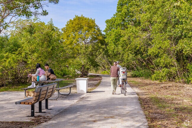 Locals enjoy the nature trail of Black Point Park & Marina in South Dade, FL.
