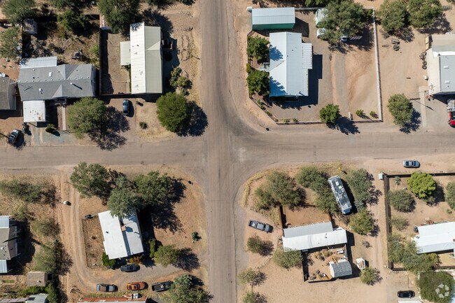 Mescal yards are typically dirt or gravel due to extreme heat and drought in Southern AZ.