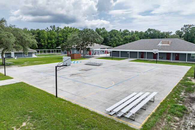 Students enjoy outdoor play on the sports courts at West Hernando Christian School.