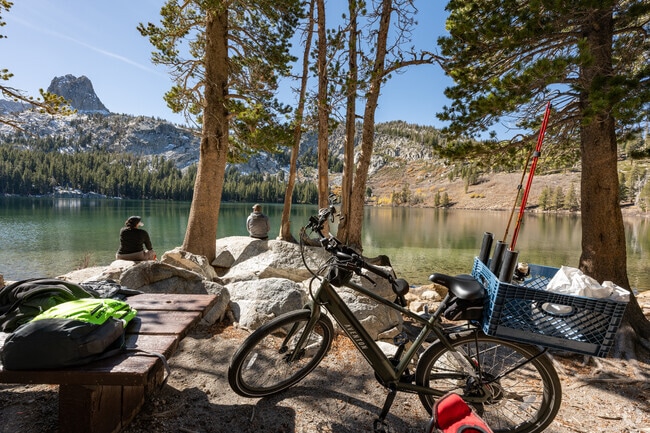 Mammoth Lakes fishermen bike up to George Lake with a view of Crystal Crag.