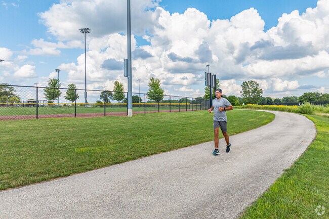 A man jogs on a path by the baseball fields at the Stuart Sports Complex in South Montgomery.