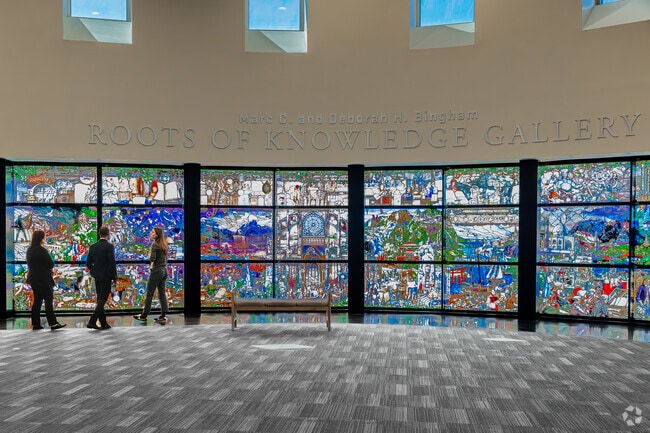 Roots of Knowledge Gallery at UVU displays colorful art near Lakeview.