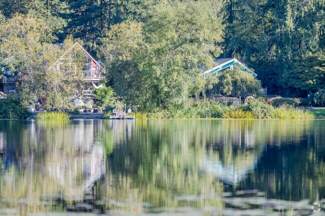 The stillness of Island Lake causes a mirror like reflection of the stunning homes in Silverdale