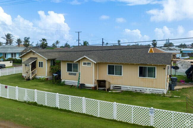 Plantation-style homes with white fences can be found in Kapaa.