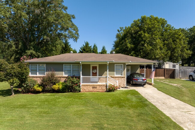 Grab a cold glass of sweet tea and escape the heat in this charming house in Gardendale.