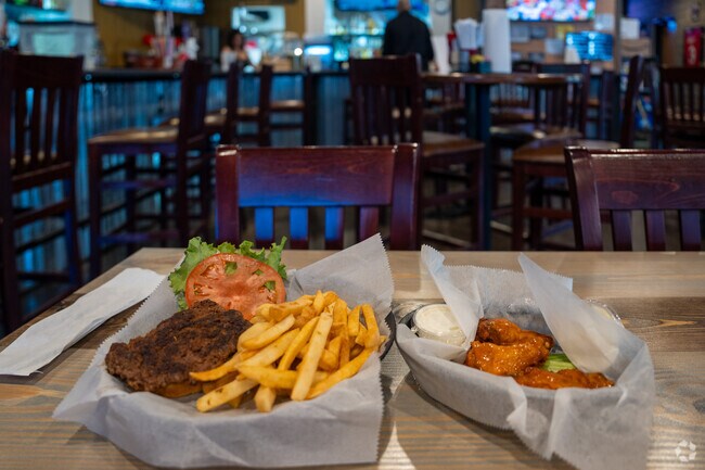 Take a bite out of some hot wings at Overtime Grill and Bar near Jones Valley.
