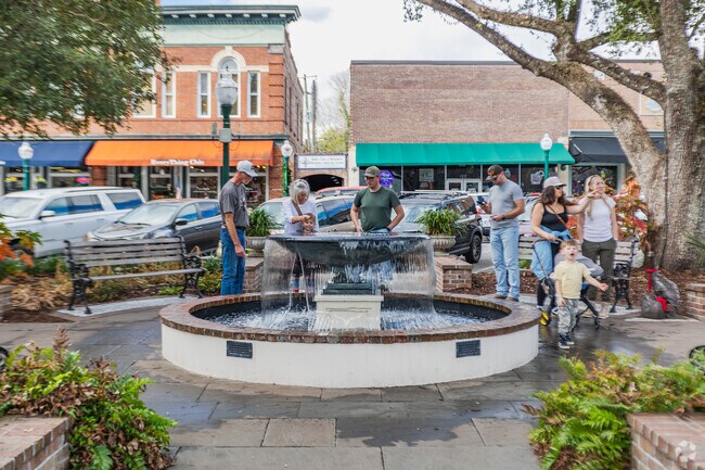Summerville families love to gather around the fountain for fun at Hutchinson Park.