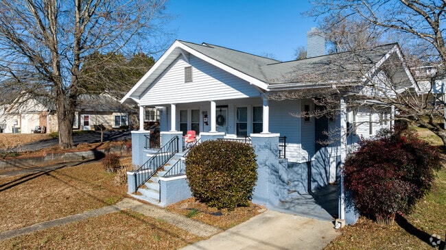 A carolina blue home in Morganton with well manicured landscaping.