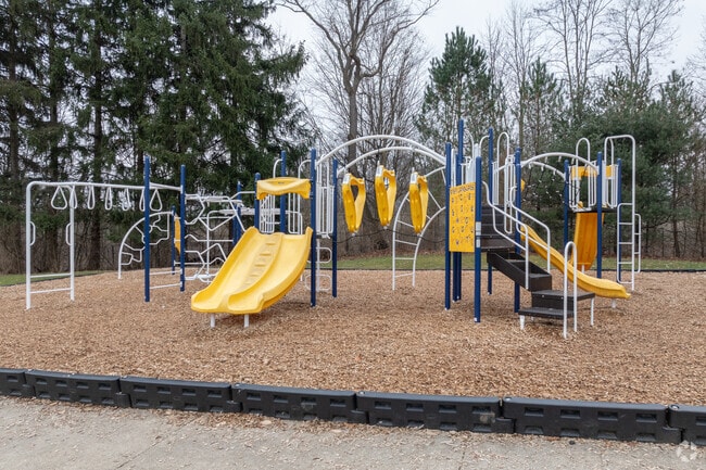 Children play on the jungle gym at recess at The Fort Island School.
