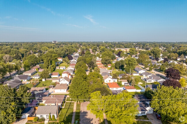 Huntley Houses homes sit on smaller lots surrounded by trees.