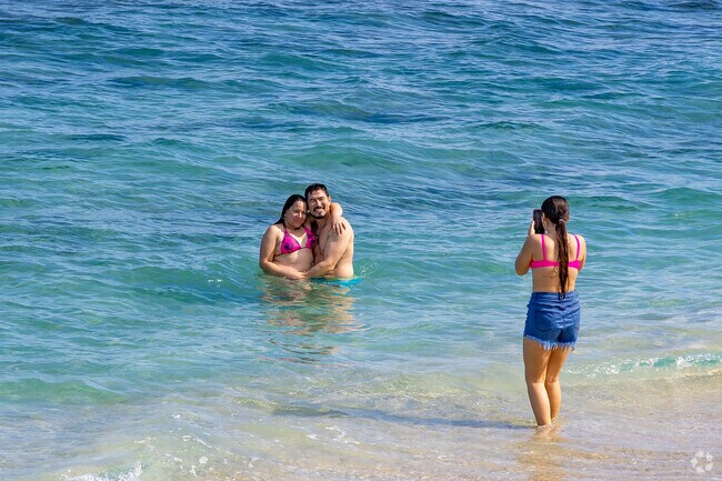 A Lantana couple at Lantana Municipal Beach enjoying ocean bliss.