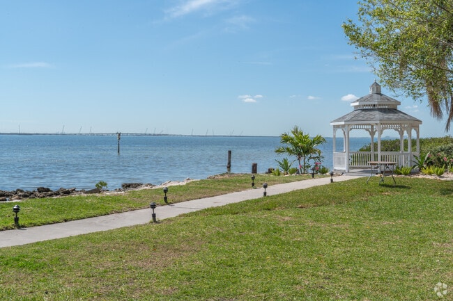 The Rusty Pelican welcomes visitors to enjoy outdoor seating by the bay.