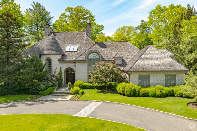 A beautiful Gedney Meadows home surrounded by mature trees and landscaping.