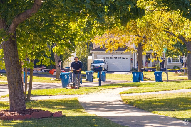 Mature trees line the streets in Aurora's North River community.