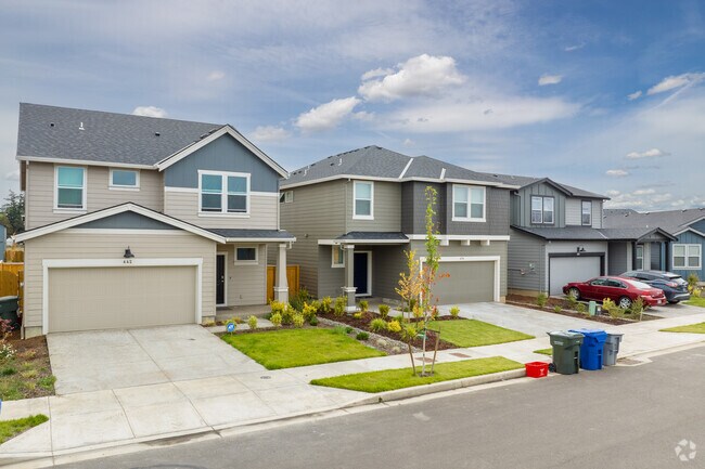 New multi-story homes in East Village Park sit on compact lots.