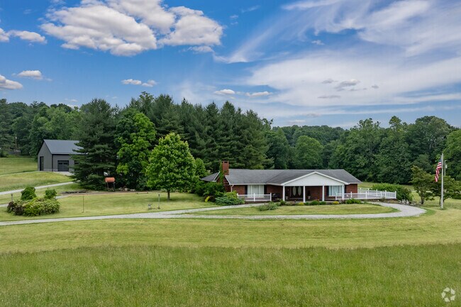 This ranch style farm house over 100 acres of land in Greenville.