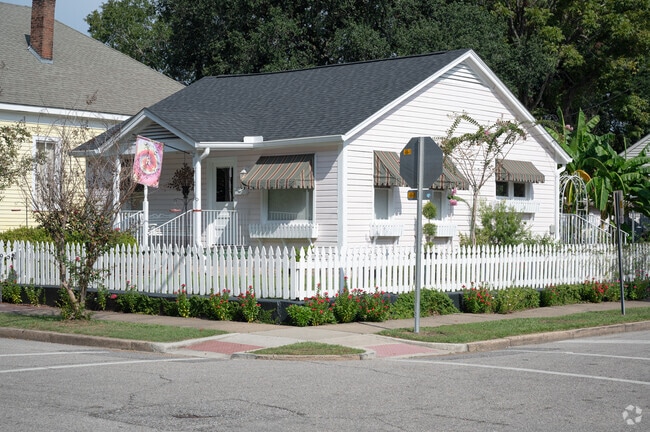 Flowers line the sidewalks around this Craftsman style home in Oakdale.