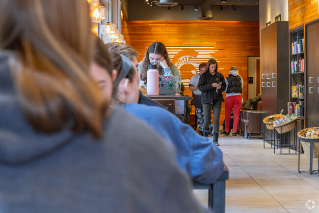 Michigan State University students enjoy time with friends in Downtown East Lansing.