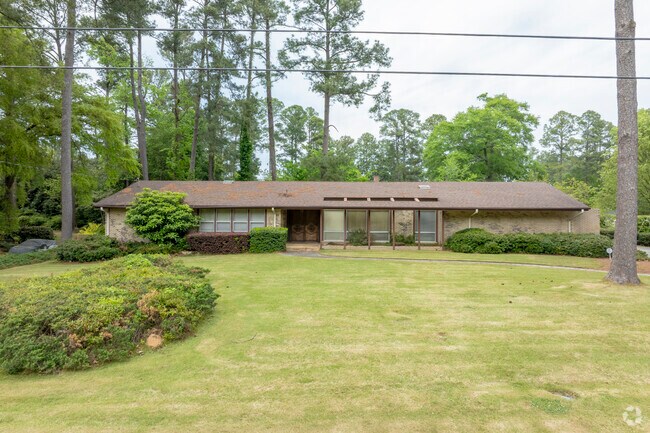 One of a few in the neighborhood, this Mid-Century Modern home makes a stunning visual plus.
