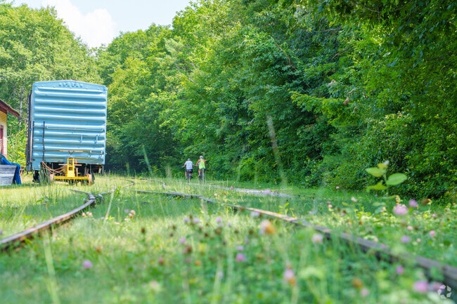 Marvel at the old train cars while your ride your bike on the Northern Rail Trail in Andover.