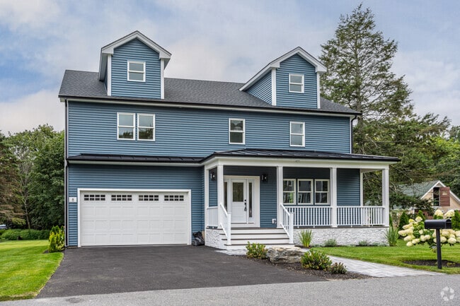 Newly constructed colonial home with large garages can be found in North Woburn.