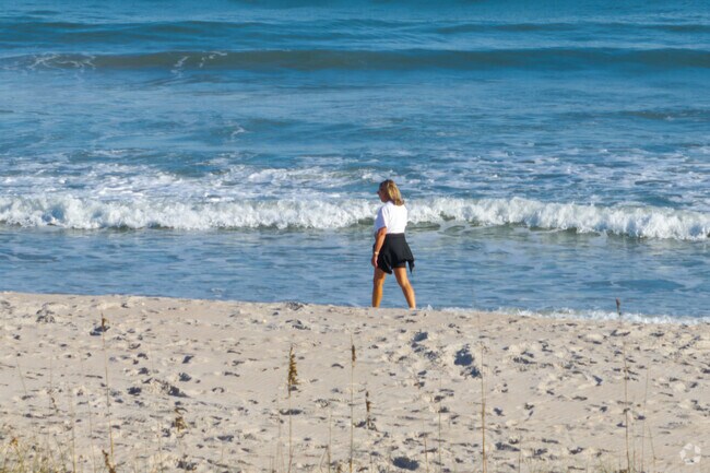 Find footprints in the sand along Surf City beach.