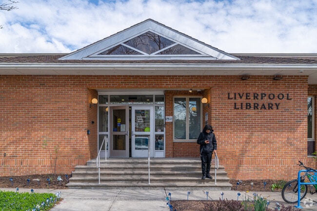 The Liverpool Library includes a children's room with a train set and dollhouse.