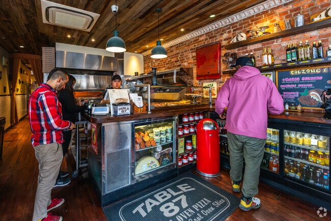 Table 87 serves excellent coal-fired pizza and other delicious dishes.