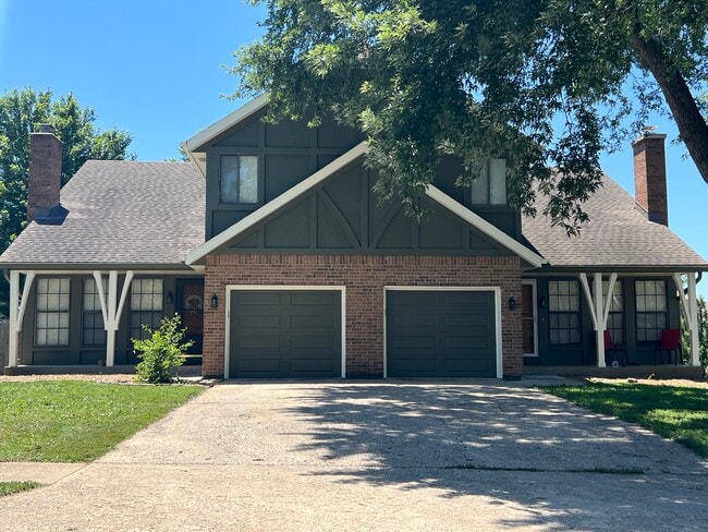 Front of duplex (unit is on the right, tree has been removed)