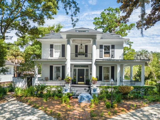 This stately colonial has a large wrap-around porch for those hot summer days.