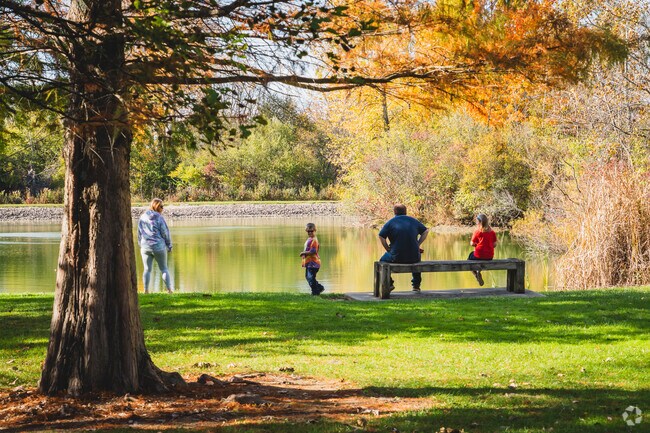 Heritage Park has a beautiful tree-lined pond with benches to take in the gorgeous scenery.