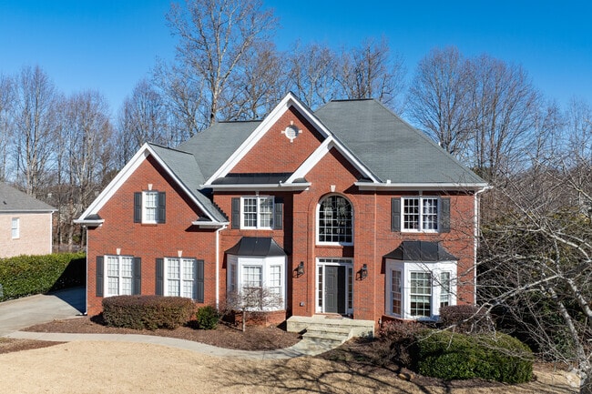 Brick exteriors dominate the neighborhood, offering a classic and timeless aesthetic.