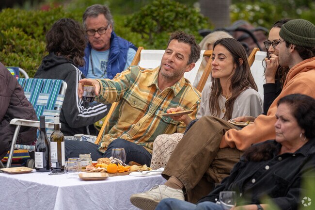 Enjoying wine and cheese with friends on the lawn makes for a lovely North Laguna evening.