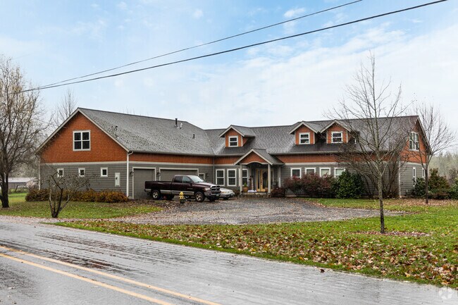 A large contemporary home sits in a rural portion of the Goshen neighborhood.